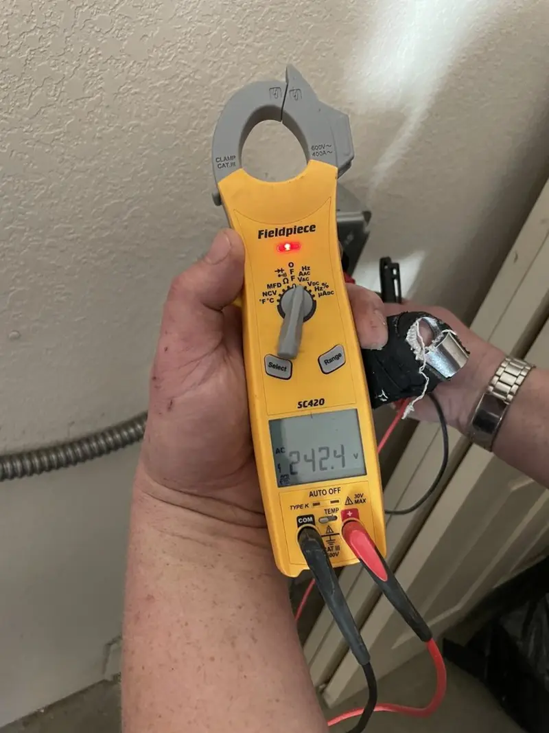 Voltage testing with clamp meter during Recessed Lighting Installation in Normal